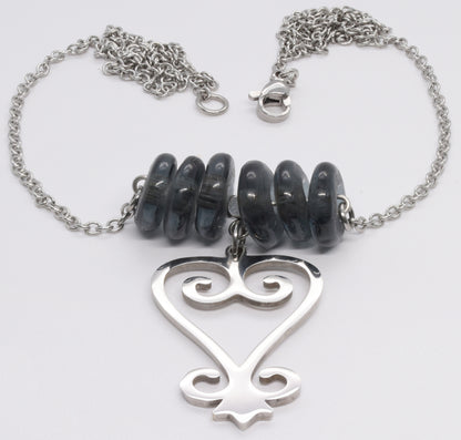 Handmade African Earrings & Pendant With Smoke Gray Beads & Adinkra Sankofa Symbol - angled shot